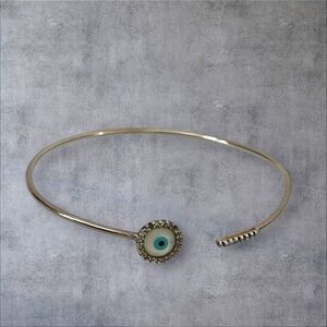 Paved clear CZ Silver bangle bracelet with a mother of pearl evil, stamped .925